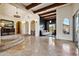 Expansive living room with tile flooring, beamed ceilings, archways, and mountain views at 4366 S Avenida De Angeles --, Gold Canyon, AZ 85118