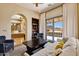 Bright living room with archway, a comfortable white couch, and patio access with mountain views at 4366 S Avenida De Angeles --, Gold Canyon, AZ 85118