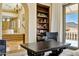 Comfortable living room featuring a bookshelf, chair, and mountain views through the window at 4366 S Avenida De Angeles --, Gold Canyon, AZ 85118