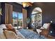 Inviting living room features a comfortable sofa, views of the outdoor pool, and a decorative rug at 4366 S Avenida De Angeles --, Gold Canyon, AZ 85118