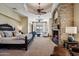 Spacious main bedroom with stone fireplace, sitting area, and access to balcony with mountain views at 4366 S Avenida De Angeles --, Gold Canyon, AZ 85118