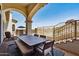 Covered patio with a dining table and views of the desert mountains at 4366 S Avenida De Angeles --, Gold Canyon, AZ 85118