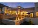 Luxurious backyard pool with outdoor seating area, fireplace, and beautiful architectural details at 4366 S Avenida De Angeles --, Gold Canyon, AZ 85118