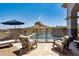Patio area with a fenced pool, seating, and scenic views of the desert landscape and blue sky at 4366 S Avenida De Angeles --, Gold Canyon, AZ 85118