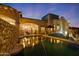 Backyard swimming pool with an umbrella-covered seating area and outdoor furniture at 4366 S Avenida De Angeles --, Gold Canyon, AZ 85118