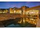 Backyard swimming pool and patio area with stone accents and comfortable lounge furniture at 4366 S Avenida De Angeles --, Gold Canyon, AZ 85118