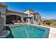 Lush backyard with a sparkling pool and outdoor lounge area, excellent for relaxation and entertaining guests at 4366 S Avenida De Angeles --, Gold Canyon, AZ 85118