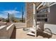 Outdoor spiral staircase with desert views and stone accents, blending architectural design with natural scenery at 4366 S Avenida De Angeles --, Gold Canyon, AZ 85118