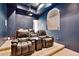 Media room with large leather recliners, projector, screen, and modern mood lighting at 4366 S Avenida De Angeles --, Gold Canyon, AZ 85118