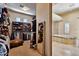Well-organized walk-in closet with built-in shelving, alongside a view into the luxurious bathroom at 4366 S Avenida De Angeles --, Gold Canyon, AZ 85118
