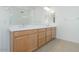 Bathroom with double sink vanity, neutral color palette and tile floor at 4822 W Owl Head Pl, San Tan Valley, AZ 85144
