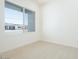 Bright bedroom featuring a large window offering natural light and a neutral carpet at 4822 W Owl Head Pl, San Tan Valley, AZ 85144