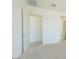 Well-lit bedroom space showcases open doorway, offering versatile design options at 4822 W Owl Head Pl, San Tan Valley, AZ 85144
