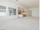 Bright open-concept living room with modern recessed lighting and a seamless view into the kitchen at 4822 W Owl Head Pl, San Tan Valley, AZ 85144