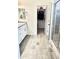 Bathroom with a double vanity, wood look tile floors, a walk in closet and glass-enclosed shower at 4956 S Leisure Way, Gilbert, AZ 85298