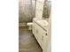 Bathroom with tiled walk-in shower, toilet and sink with storage cabinet at 4956 S Leisure Way, Gilbert, AZ 85298
