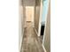 Hallway with tile flooring, leading to various rooms, showcasing the home's layout at 4956 S Leisure Way, Gilbert, AZ 85298