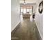 Inviting hallway with views of the living room, patio, and wood-style tile flooring at 4956 S Leisure Way, Gilbert, AZ 85298
