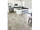 Bright kitchen with stainless steel appliances, black countertops, white cabinets and tile floors at 4956 S Leisure Way, Gilbert, AZ 85298