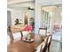 Open-concept living and dining area with access to an outdoor patio through sliding glass doors at 4956 S Leisure Way, Gilbert, AZ 85298