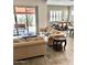 Open-concept living space featuring tile floors, a dining area, and access to a covered patio at 4956 S Leisure Way, Gilbert, AZ 85298