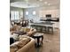 Open-concept living space connecting living, dining, and kitchen areas with sleek finishes and ample natural light at 4956 S Leisure Way, Gilbert, AZ 85298