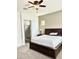 Main bedroom with carpet and ensuite bathroom at 4956 S Leisure Way, Gilbert, AZ 85298