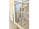 Modern tiled walk in shower with glass enclosure and shower seat at 4956 S Leisure Way, Gilbert, AZ 85298