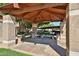 View of a covered carport area with parking spaces and surrounding greenery for residents at 5757 W Eugie Ave # 2068, Glendale, AZ 85304
