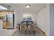 A cozy dining area featuring modern décor and adjacent to a kitchen with stainless steel appliances at 5757 W Eugie Ave # 2068, Glendale, AZ 85304