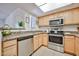 Bright kitchen features stainless steel appliances, granite countertops, and wood cabinets at 5757 W Eugie Ave # 2068, Glendale, AZ 85304