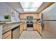 Kitchen featuring stainless steel appliances, ample counter space, and a skylight for natural lighting at 5757 W Eugie Ave # 2068, Glendale, AZ 85304