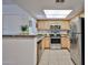 Well-lit kitchen featuring stainless steel appliances, ample counter space, and natural lighting from a skylight at 5757 W Eugie Ave # 2068, Glendale, AZ 85304