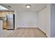 Open floor plan with wood-look flooring, neutral paint, and kitchen view at 5757 W Eugie Ave # 2068, Glendale, AZ 85304