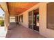 Covered back porch offers natural stone tile, ceiling and sliding door access at 5919 W Straight Arrow Ln, Phoenix, AZ 85083