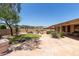 Backyard with stone tile and desert landscaping at 5919 W Straight Arrow Ln, Phoenix, AZ 85083