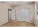 Bedroom with double closets and access to an ensuite bathroom at 5919 W Straight Arrow Ln, Phoenix, AZ 85083
