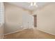 Bedroom features neutral walls, double door closet and access to ensuite bathroom at 5919 W Straight Arrow Ln, Phoenix, AZ 85083