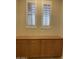 Built-in cabinets under two shuttered windows offer substantial storage at 5919 W Straight Arrow Ln, Phoenix, AZ 85083