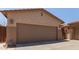 Exterior of home featuring an attached two-car garage and extended driveway at 5919 W Straight Arrow Ln, Phoenix, AZ 85083