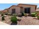 Beautiful desert landscaping adds curb appeal to this lovely home at 5919 W Straight Arrow Ln, Phoenix, AZ 85083