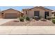 Charming single-story home featuring a well-maintained front yard with desert landscaping at 5919 W Straight Arrow Ln, Phoenix, AZ 85083
