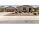 Charming single-story home featuring a well-maintained front yard with desert landscaping at 5919 W Straight Arrow Ln, Phoenix, AZ 85083