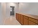 Hallway with tile flooring and cabinet at 5919 W Straight Arrow Ln, Phoenix, AZ 85083