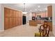 Well-equipped kitchen with tile floors, a central island, and generous cabinet space at 5919 W Straight Arrow Ln, Phoenix, AZ 85083