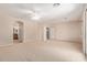 Expansive living room with ceiling fan and views of the bathroom at 5919 W Straight Arrow Ln, Phoenix, AZ 85083