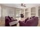 Comfortable living room features tile floors, built-in shelving, and sliding glass doors at 5919 W Straight Arrow Ln, Phoenix, AZ 85083