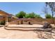 Built-in outdoor kitchen and entertainment area with stylish stone accents and ample space for gatherings at 5919 W Straight Arrow Ln, Phoenix, AZ 85083