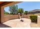 Covered patio area with stone flooring, offering an inviting outdoor lounge space at 5919 W Straight Arrow Ln, Phoenix, AZ 85083