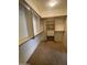 Walk-in closet featuring ample shelving and custom storage solutions at 5919 W Straight Arrow Ln, Phoenix, AZ 85083